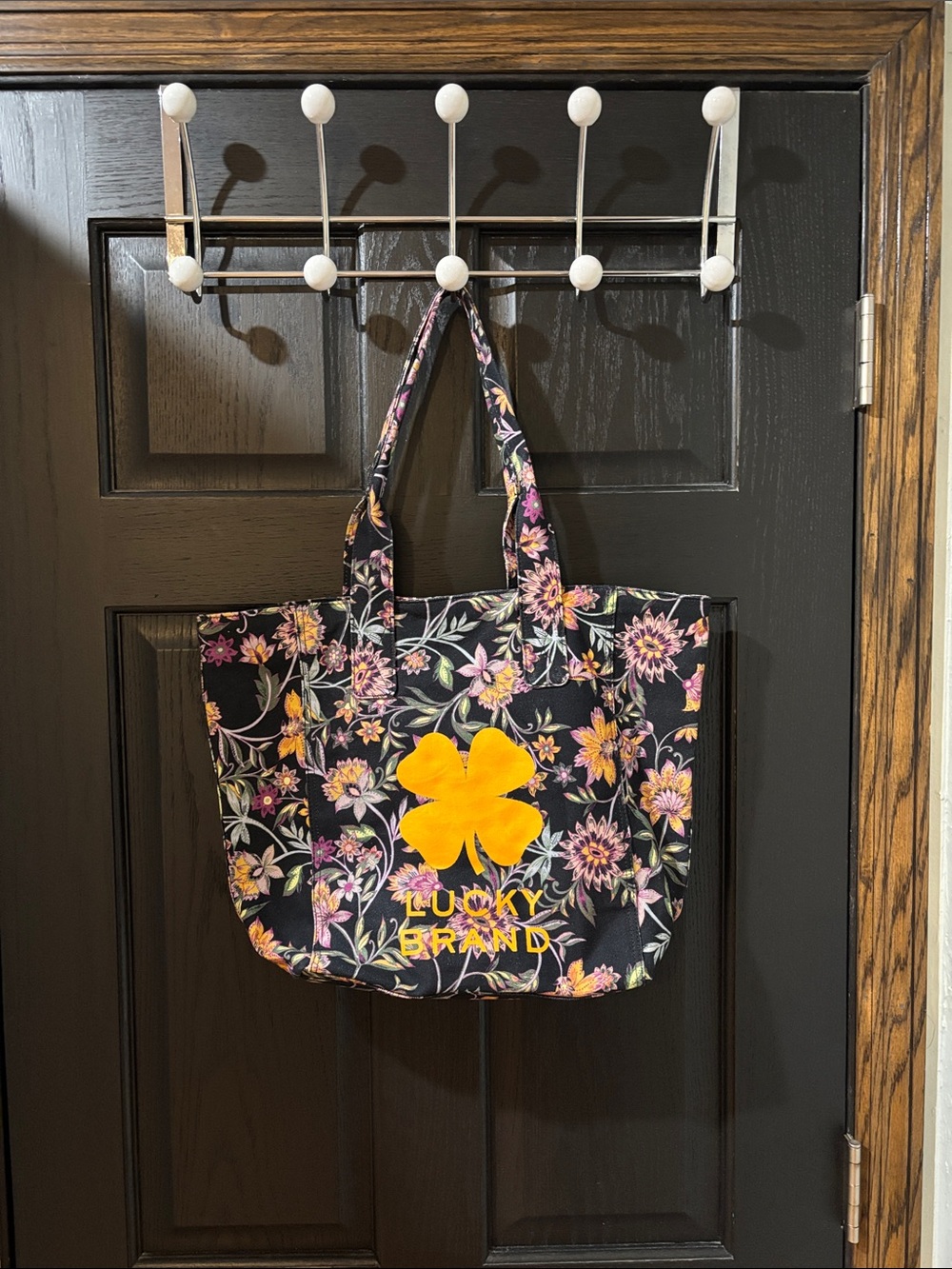 Lucky Brand Black Floral Tote with Yellow Flower Emblem